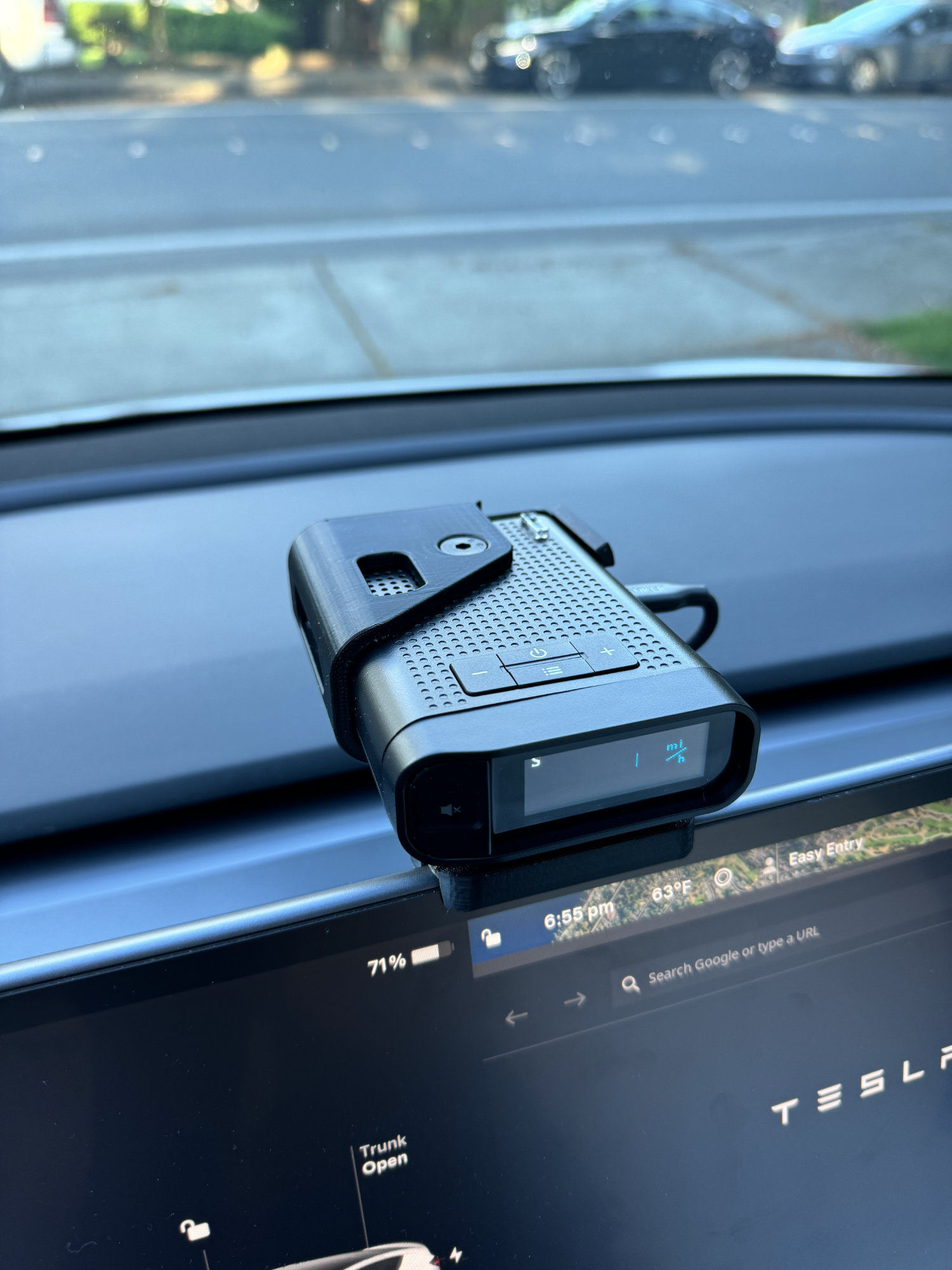 View of the Radenso DS1 installed in the bracket mounted in a Tesla