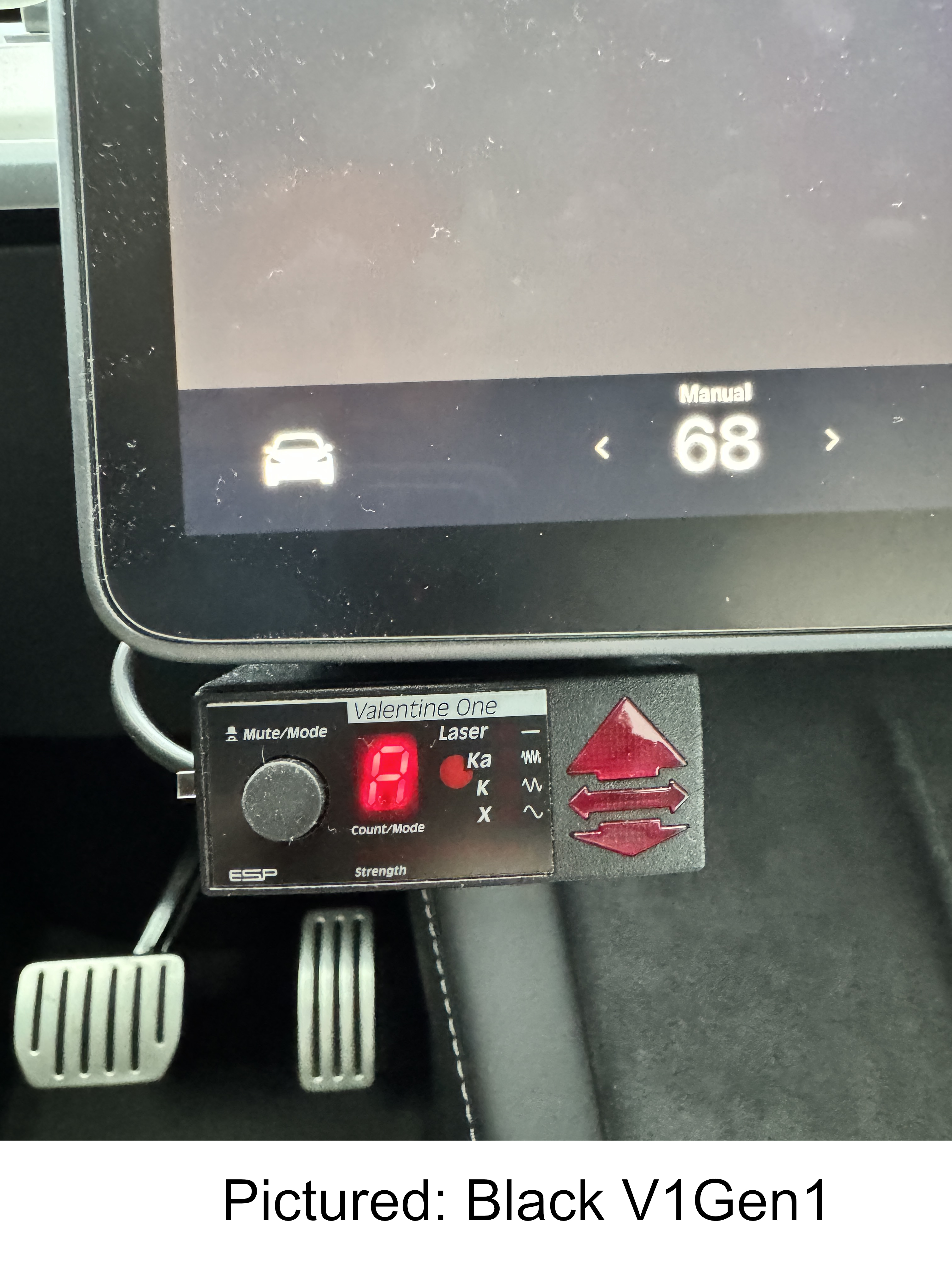 Front view of the display unit mounted on the bottom screen of a Tesla