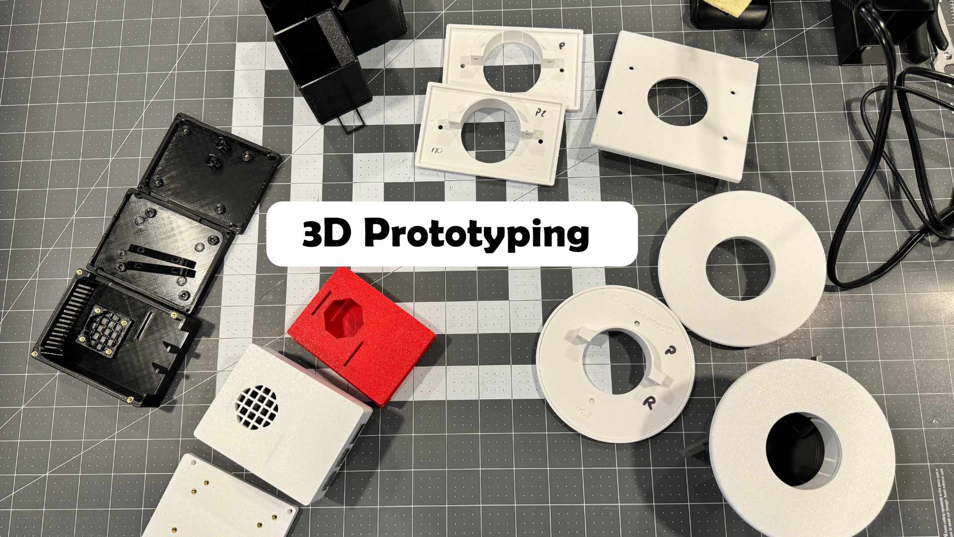 a photo of a desk containing various 3D printed prototypes like covers, cases and containers showcasing our prototyping services
